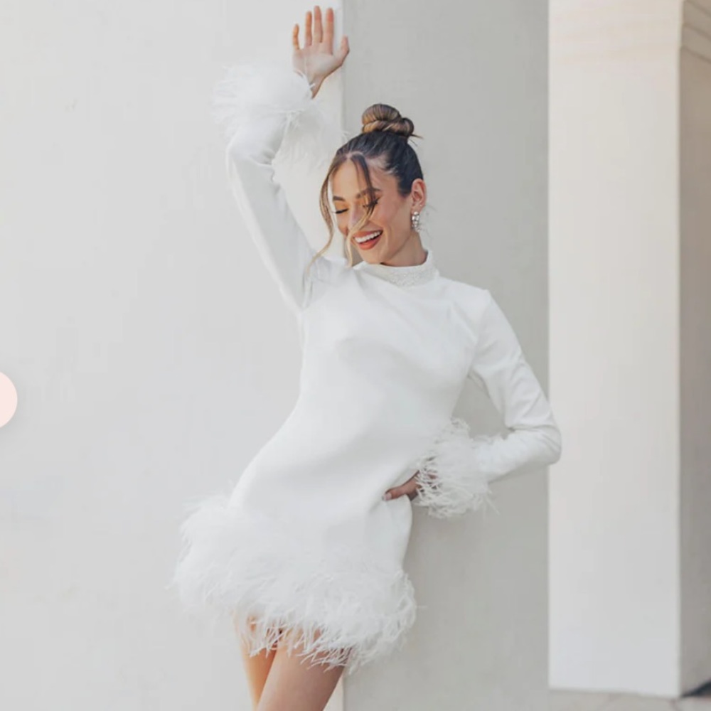 White long sleeve feather trim mini dress with pearl neckline